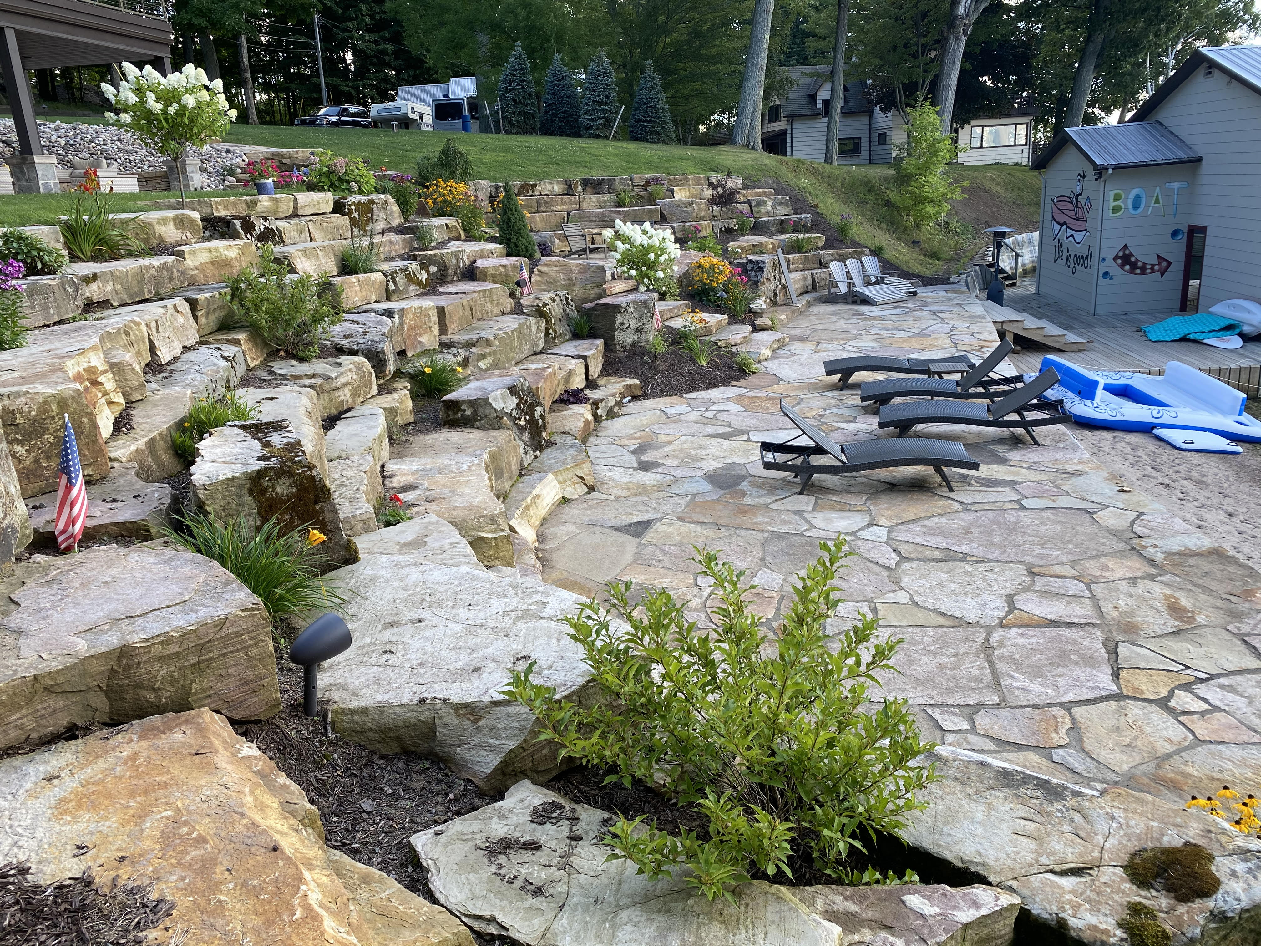 Boulder Retaining Wall with Flagstone Patio